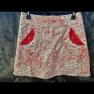 This is a beautiful Marc Jacobs skirt. White underlay with red design.